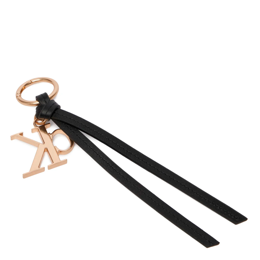 porte-cles-de-sac-a-main-avec-pompon-et-logo-distinctif-en-cuir porte-cles-de-sac-a-main-avec-pompon-et-logo-distinctif-en-cuir